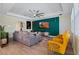 Stylish living room with a teal accent wall and modern decor at 11927 Charades St, Orlando, FL 32832