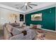 Inviting living room showcasing an accent wall and wood flooring at 11927 Charades St, Orlando, FL 32832