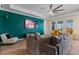 Bright living room features an accent wall and comfortable seating at 11927 Charades St, Orlando, FL 32832
