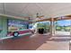 Outdoor community kitchen featuring a covered cooking area, a grill, and views of the common area at 11927 Charades St, Orlando, FL 32832