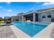Expansive backyard pool with a stylish patio, a covered lanai, and lush landscaping for ultimate outdoor living at 11927 Charades St, Orlando, FL 32832