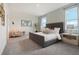 A cozy bedroom featuring a padded headboard, soft carpet, natural light, and a calming color palette at 1240 Blue Daze Ln, Eustis, FL 32726