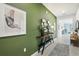 Bright entryway featuring a console table with decor and a tiled floor at 1240 Blue Daze Ln, Eustis, FL 32726