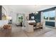 Open-concept living area and dining space with stylish furnishings and modern decor at 1240 Blue Daze Ln, Eustis, FL 32726