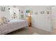 Bedroom features a window, dresser, closet and soft, patterned bedding at 125 Silver Maple Rd, Groveland, FL 34736