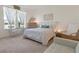 Bright bedroom with ample natural light and cozy seating area at 125 Silver Maple Rd, Groveland, FL 34736