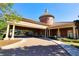 Inviting clubhouse entrance with elegant portico and brick paver drive at 125 Silver Maple Rd, Groveland, FL 34736