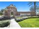 Landscaped entrance to the Trilogy community features a decorative sign and meticulously maintained surroundings at 125 Silver Maple Rd, Groveland, FL 34736