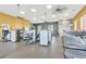 Spacious fitness center with modern exercise equipment and ceiling fans at 125 Silver Maple Rd, Groveland, FL 34736