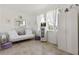Bright flex room with natural light, tile floors, sofa, and white wardrobe at 125 Silver Maple Rd, Groveland, FL 34736