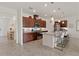 Spacious kitchen with a center island, granite countertops, stainless appliances and ample cabinet space at 125 Silver Maple Rd, Groveland, FL 34736