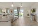 Open floor plan with a modern kitchen island overlooking a comfortable living area and a bright, open atmosphere at 125 Silver Maple Rd, Groveland, FL 34736