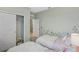 Playful bedroom featuring two twin beds, floral accents, and ample closet space at 1251 Blue Daze Ln, Eustis, FL 32726