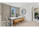 Bright dining area with a table, bench, chairs and large window with backyard view at 1251 Blue Daze Ln, Eustis, FL 32726