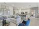 Spacious living area connected to kitchen, with modern furniture and stylish decor accents at 1251 Blue Daze Ln, Eustis, FL 32726
