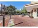Inviting street view with brick sidewalks, decorative planters, and a vintage clock, creating a charming and pedestrian-friendly atmosphere at 1251 Blue Daze Ln, Eustis, FL 32726