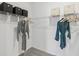 Organized walk-in closet with shelving, hanging rods, and ample storage space at 1251 Blue Daze Ln, Eustis, FL 32726