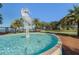 Striking water fountain feature with a sculpture and lush green landscaping in a lakeside park at 1251 Blue Daze Ln, Eustis, FL 32726