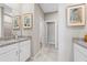 Bathroom showcasing double sinks, granite countertops and tiled flooring at 1252 Blue Daze Ln, Eustis, FL 32726