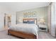 Inviting bedroom featuring a comfortable bed, wood accents and lots of natural light at 1252 Blue Daze Ln, Eustis, FL 32726