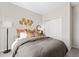 Stylish bedroom features modern décor, comfortable bed, and accent lighting at 1252 Blue Daze Ln, Eustis, FL 32726