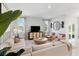 Comfortable living room features ample seating, stylish decor, and seamless access to the outdoor area at 1252 Blue Daze Ln, Eustis, FL 32726
