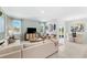 Spacious living room with modern furniture, large windows, and view to the backyard at 1252 Blue Daze Ln, Eustis, FL 32726