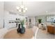 Well-lit living space showcasing the seamless flow between the kitchen, dining area, and cozy living room at 1252 Blue Daze Ln, Eustis, FL 32726