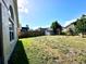 Large backyard featuring a lush green lawn, great for outdoor activities at 128 Brushcreek Dr, Sanford, FL 32771