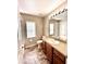 Bathroom featuring vanity, commode, window, and tub with shower at 128 Brushcreek Dr, Sanford, FL 32771