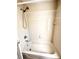 Bathroom tub with shower and neutral-colored tiles at 128 Brushcreek Dr, Sanford, FL 32771