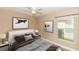 Cozy bedroom with a neutral color palette, artwork, and a ceiling fan at 128 Brushcreek Dr, Sanford, FL 32771