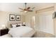 Comfortable bedroom with a decorative bench, neutral decor, and ensuite access at 128 Brushcreek Dr, Sanford, FL 32771