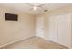 Spacious bedroom with carpet floors, ceiling fan, closet, and a TV at 128 Brushcreek Dr, Sanford, FL 32771
