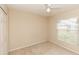 Spare bedroom features carpet floors, a ceiling fan and a window at 128 Brushcreek Dr, Sanford, FL 32771