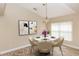 A charming dining room with a modern chandelier and neutral decor at 128 Brushcreek Dr, Sanford, FL 32771