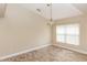 Dining room with light-colored walls, tile flooring, and a chandelier overhead at 128 Brushcreek Dr, Sanford, FL 32771