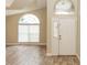 Home's entryway with tile floors and arched windows providing natural light into the living space at 128 Brushcreek Dr, Sanford, FL 32771