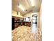 Spacious kitchen featuring stainless appliances, wood cabinets, tile floors and high ceilings at 128 Brushcreek Dr, Sanford, FL 32771