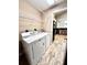 Laundry room featuring a washer and dryer with access to kitchen at 128 Brushcreek Dr, Sanford, FL 32771