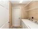 Laundry room boasts a new washer and dryer, plus a wire shelf for storage at 128 Brushcreek Dr, Sanford, FL 32771