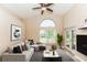 Bright living room with vaulted ceilings, and large windows for plenty of natural light at 128 Brushcreek Dr, Sanford, FL 32771