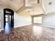 Large living room showing high ceilings, tile floors, ceiling beams, neutral paint and open floor plan at 128 Brushcreek Dr, Sanford, FL 32771