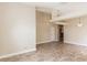 Large living room with light-colored tile flooring, light walls, and light fixtures hanging from the ceiling at 128 Brushcreek Dr, Sanford, FL 32771
