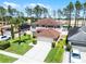 Aerial view of a lovely two-story home with well-maintained landscaping, an attached garage, and a spacious driveway at 140 Elgin Blvd, Davenport, FL 33897