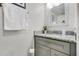 Bathroom featuring a granite countertop, single sink, and a mirror at 140 Elgin Blvd, Davenport, FL 33897