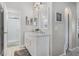 Bright bathroom boasts a double vanity and a glass-enclosed shower at 140 Elgin Blvd, Davenport, FL 33897