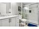 Clean bathroom features walk-in shower with glass door, modern vanity, and tile flooring at 140 Elgin Blvd, Davenport, FL 33897