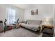 This bedroom features a comfortable futon, exercise equipment and soft natural light at 140 Elgin Blvd, Davenport, FL 33897