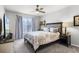 Cozy bedroom with large window, stylish furnishings, and carpet flooring at 140 Elgin Blvd, Davenport, FL 33897